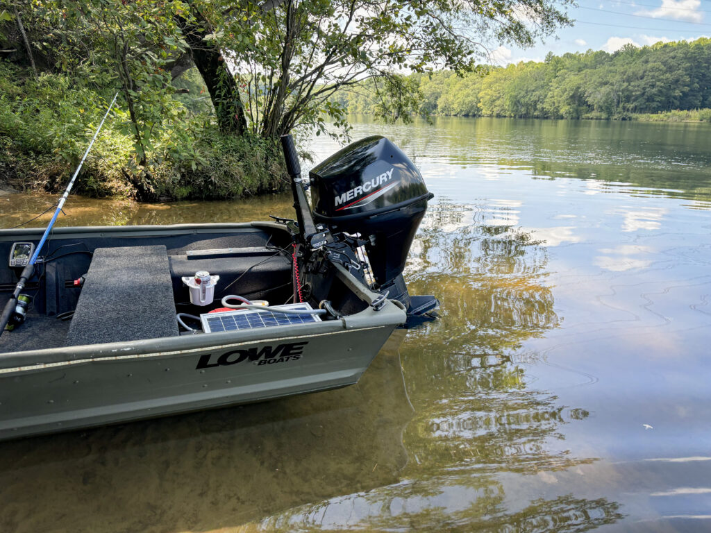 a jon boat moored on the shore at Mountain Island Lake by the Cowan's Ford Dam.